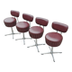 Set of 4 Mid Century Modern swivel chairs in tubular steel and leather.