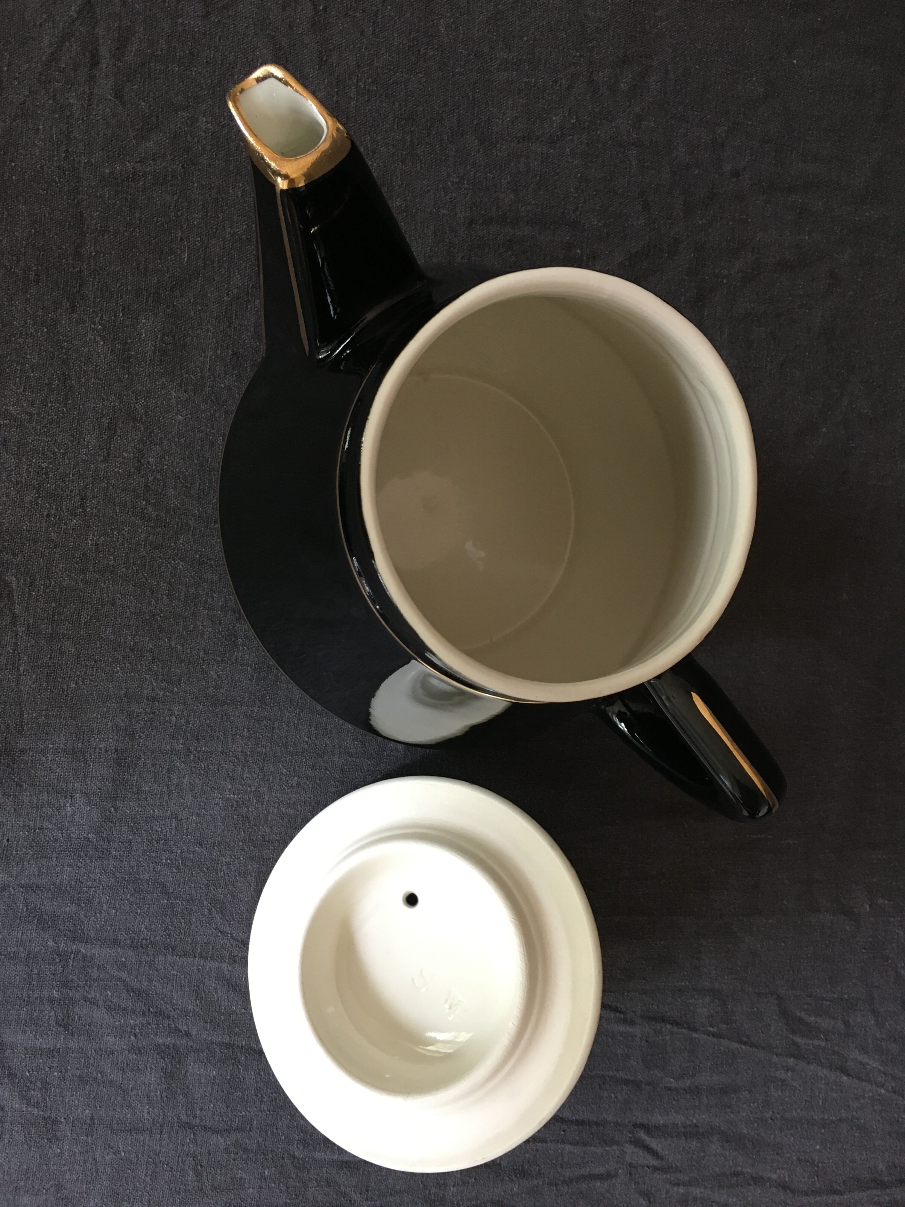 Black and gold ceramic coffee maker