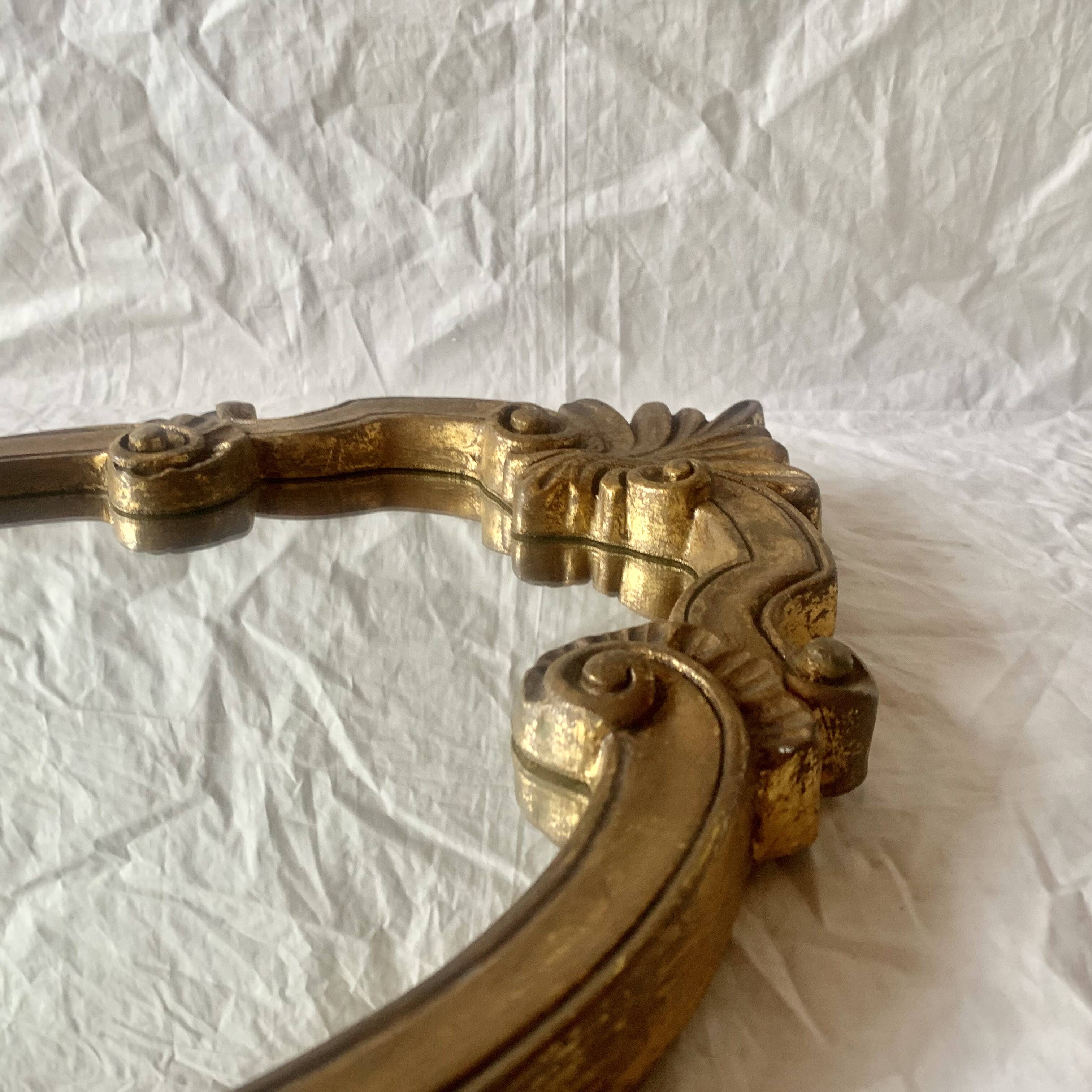 Vintage wall mirror in gold resin