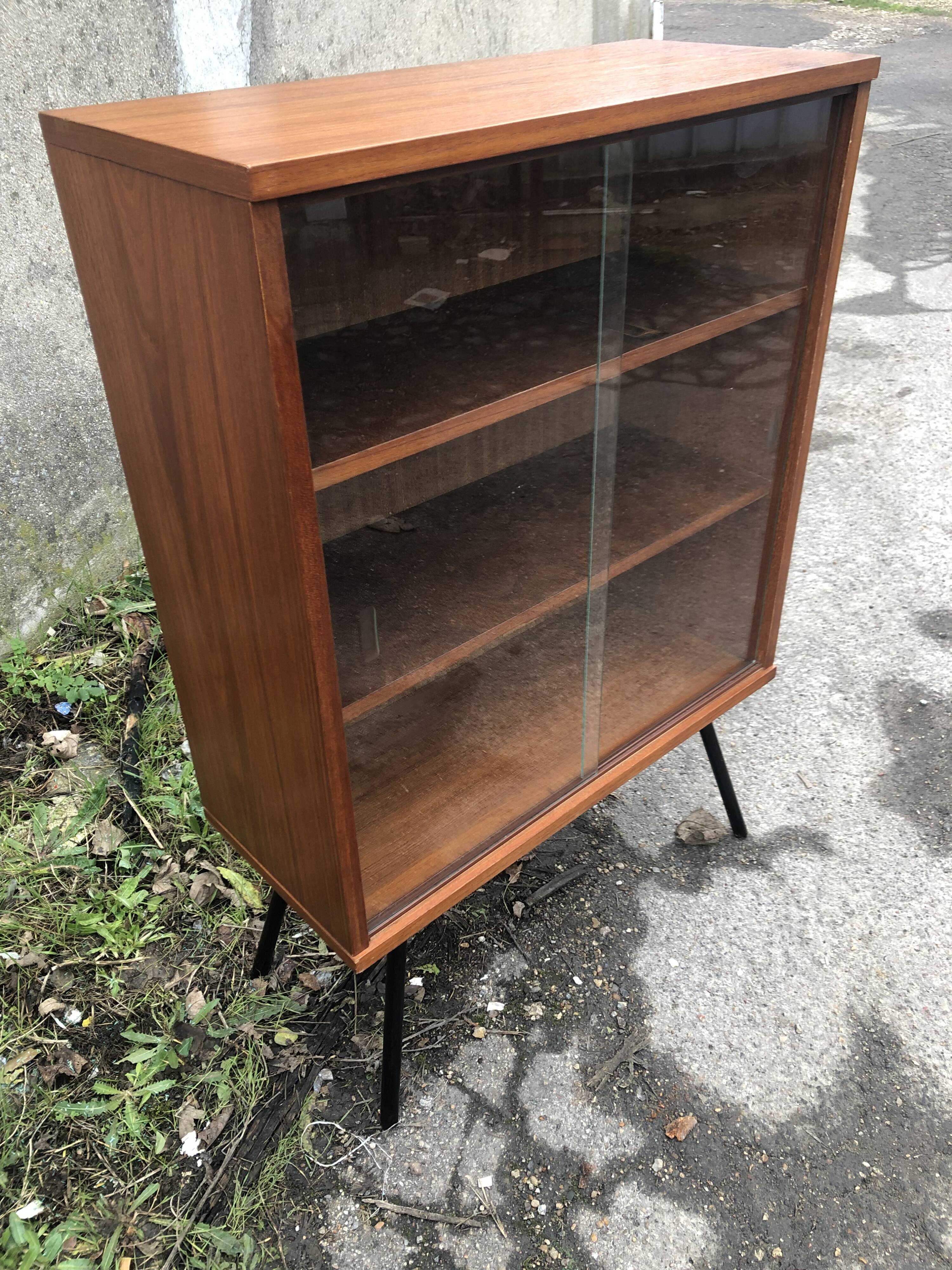 Library showcase with sliding glass doors 60s