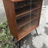 Library showcase with sliding glass doors 60s