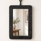 Vintage black wall mirror with floral decoration