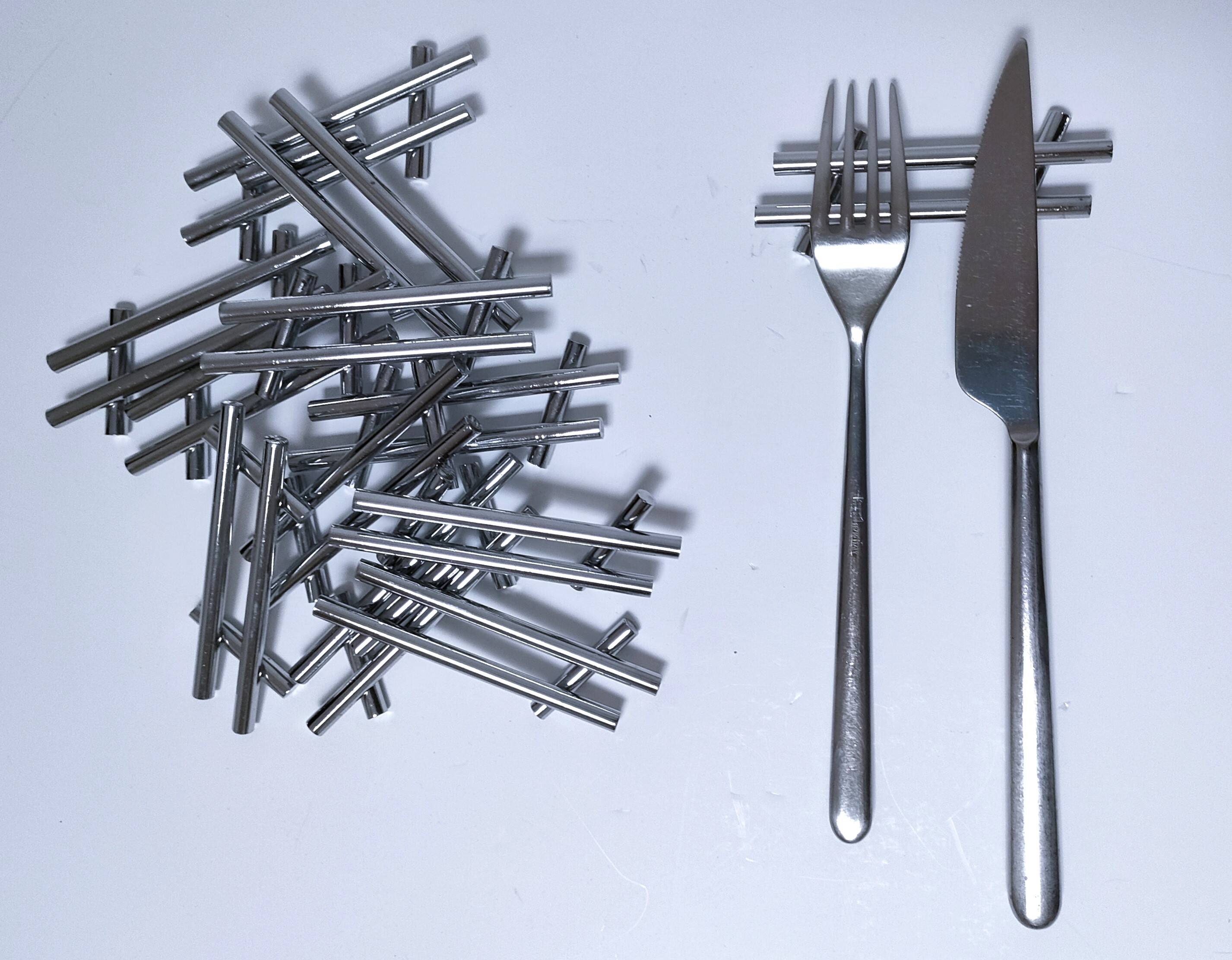 Twelve 70s design metal knife holders