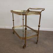 Desserte roulante en laiton doré et verre