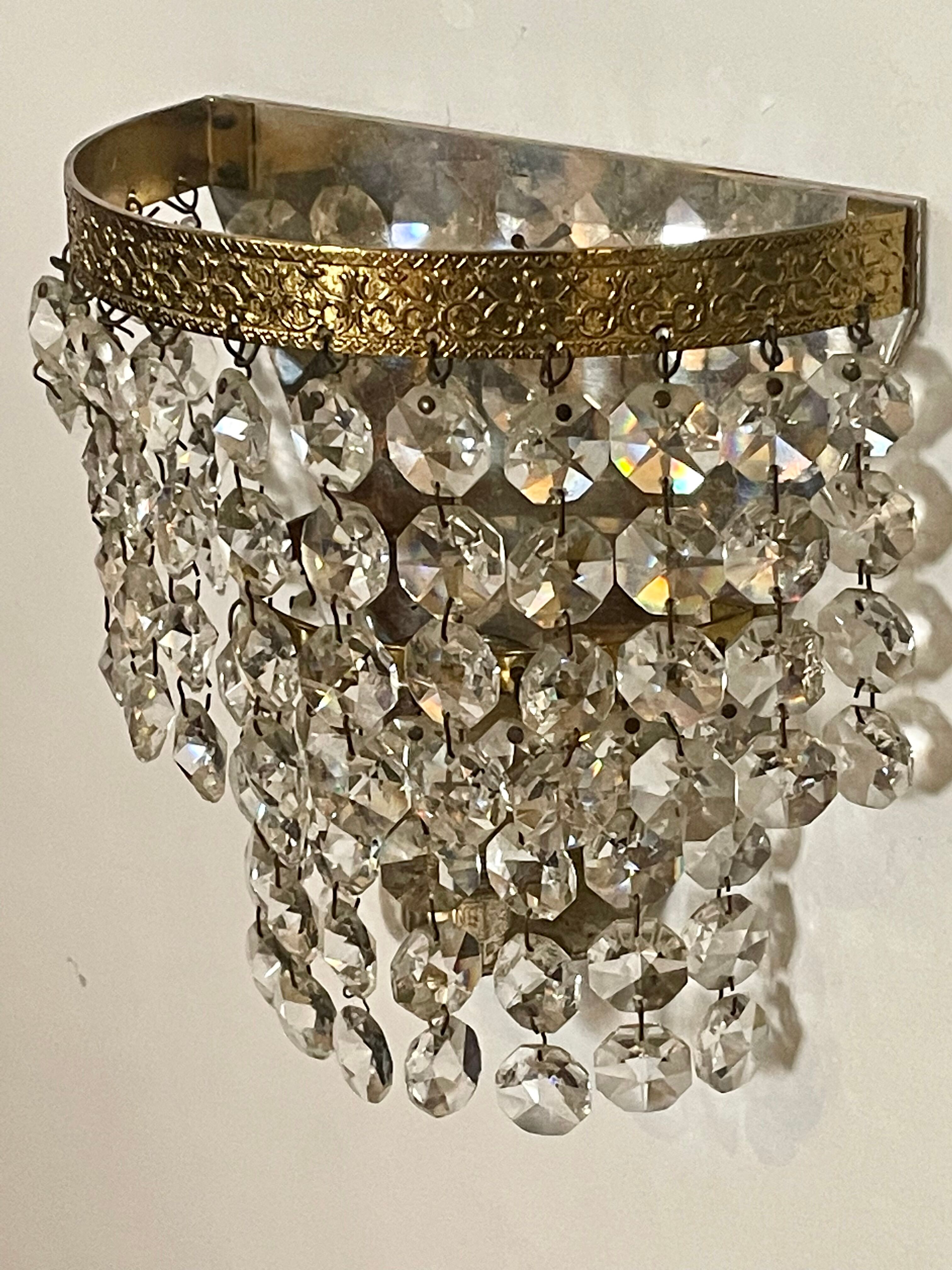 Pair of brass sconces and tassels