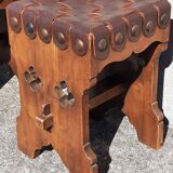 Pair of brutalist stools, leather seat.
