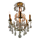 Gilded bronze chandelier trimmed with drop-shaped stamps