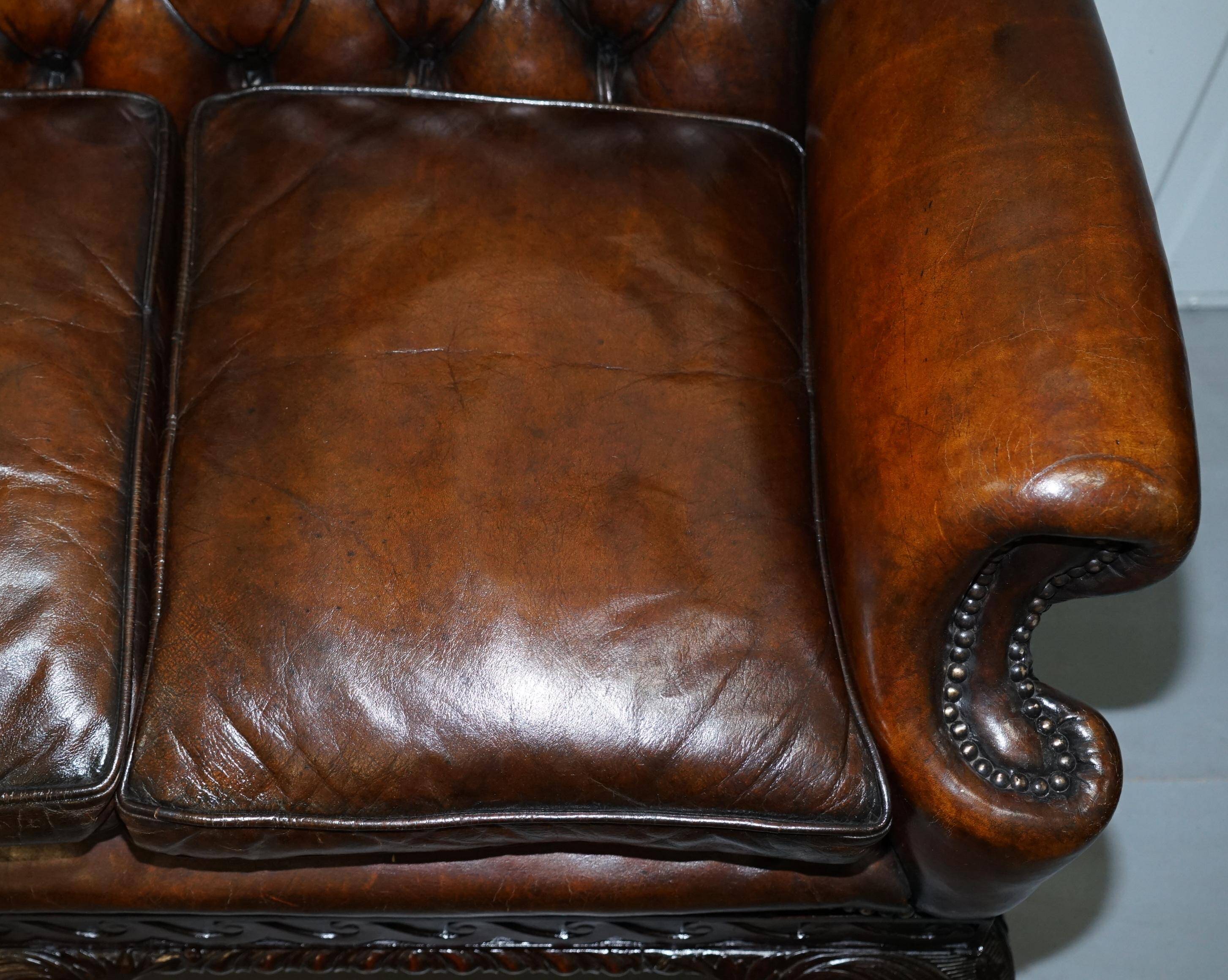 Chesterfield leather canapé in Georgian style with lion paw carved feet.