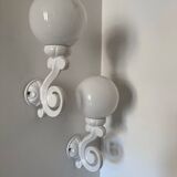 Cast iron and opaline wall lights from the 70s