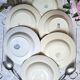 Antique deep plates in ironstone with a soup tureen.