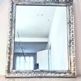 Old mercury mirror, in carved wood with silver leaf.