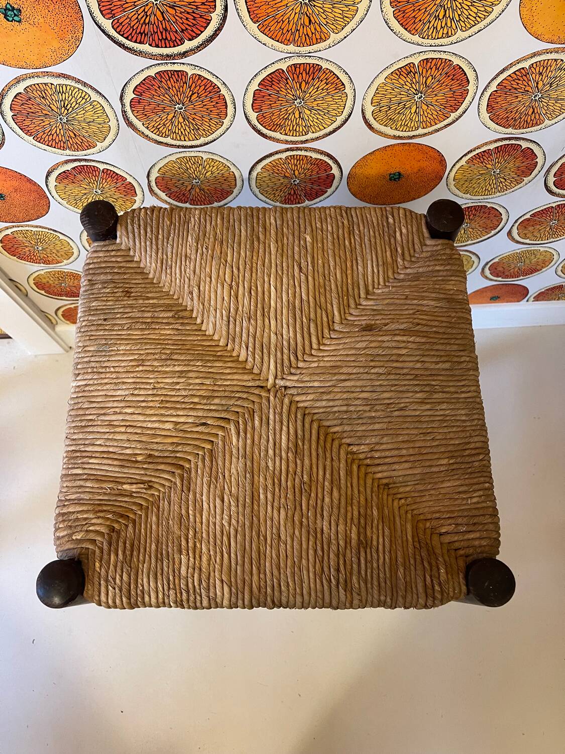 High stool made of wood and straw