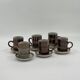 Set of 6 vintage handmade stoneware cups and saucers.