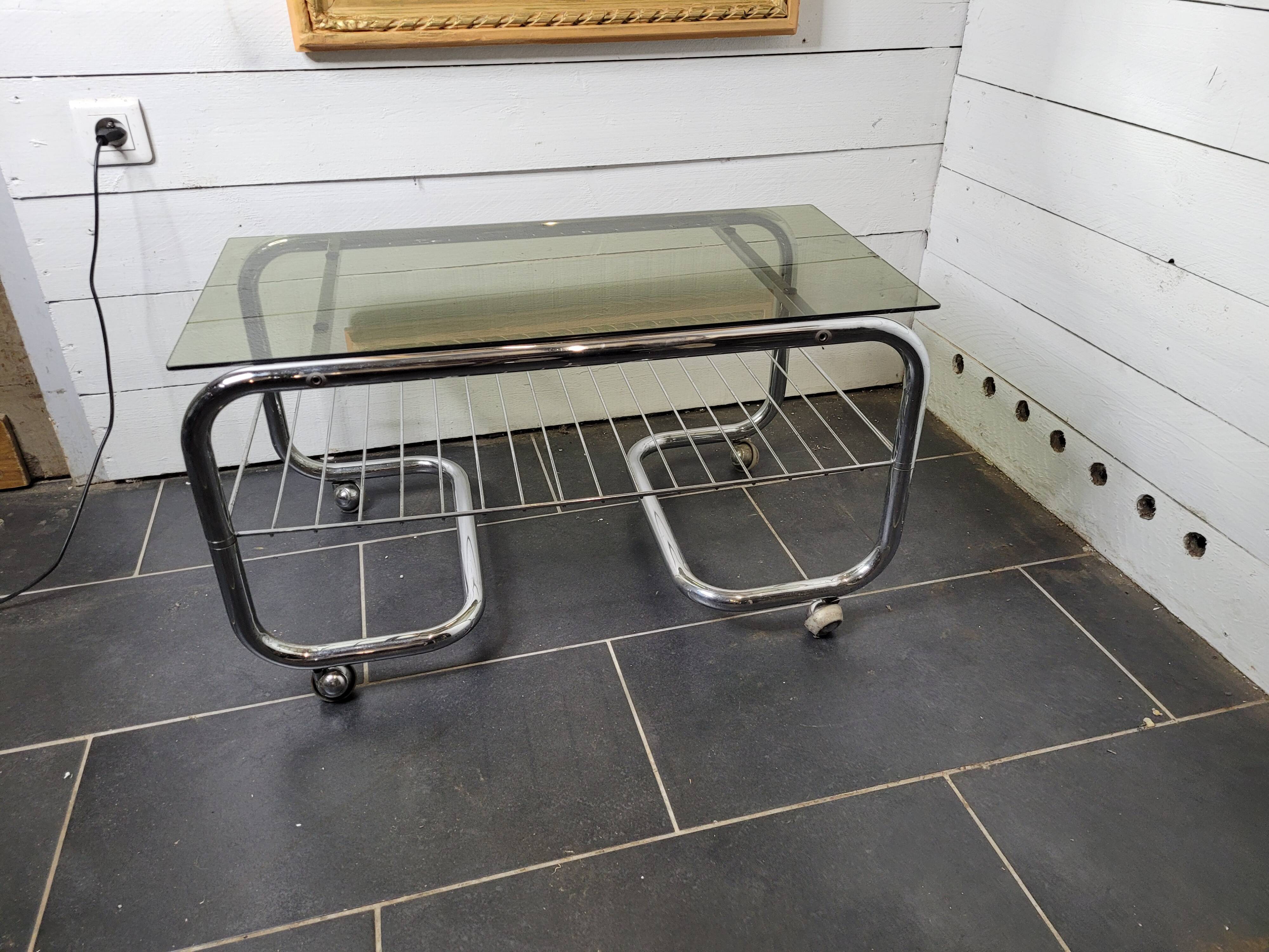 Coffee table with chrome base and smoked glass from the 70s