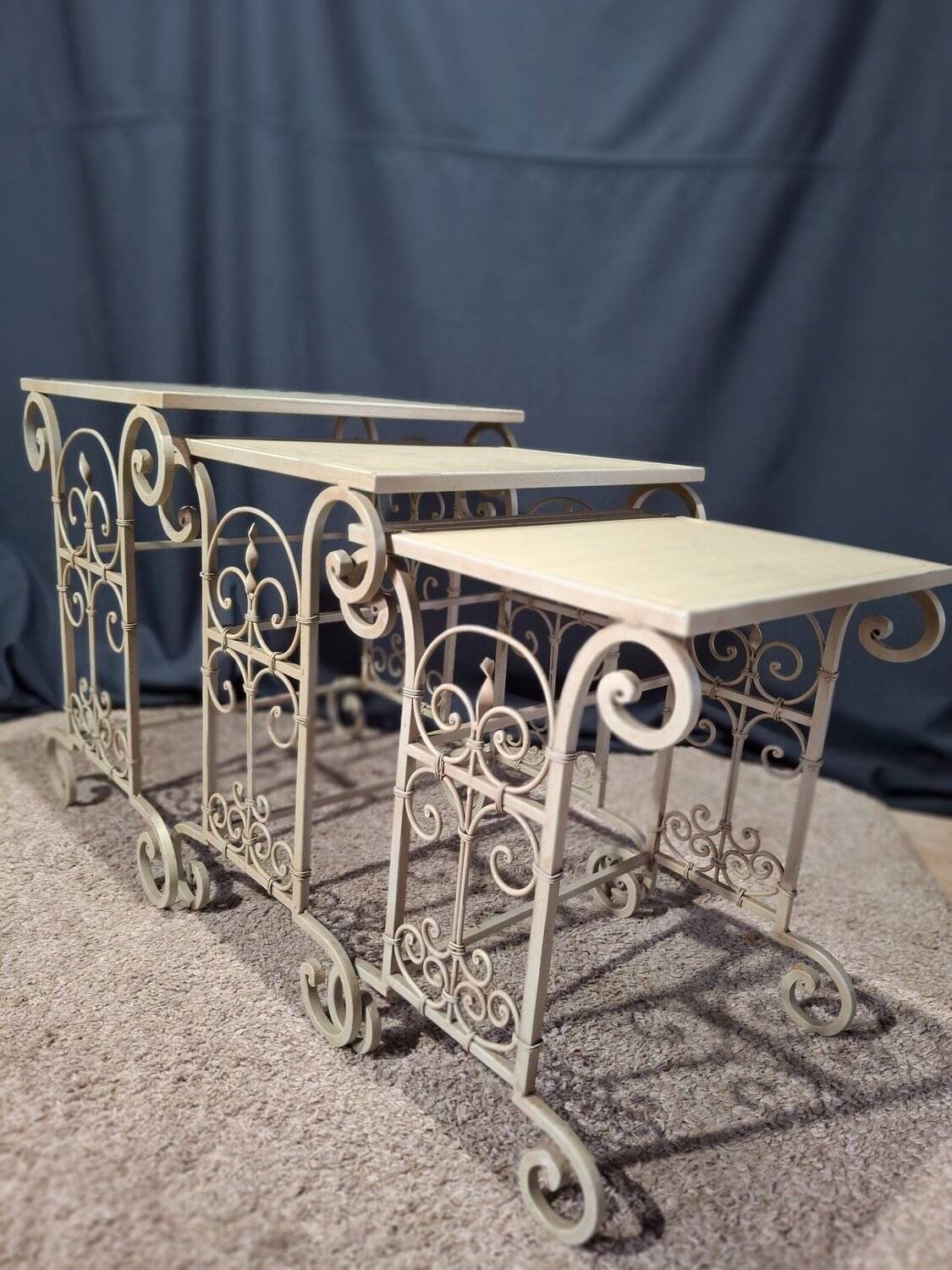 Nesting tables in patinated iron.