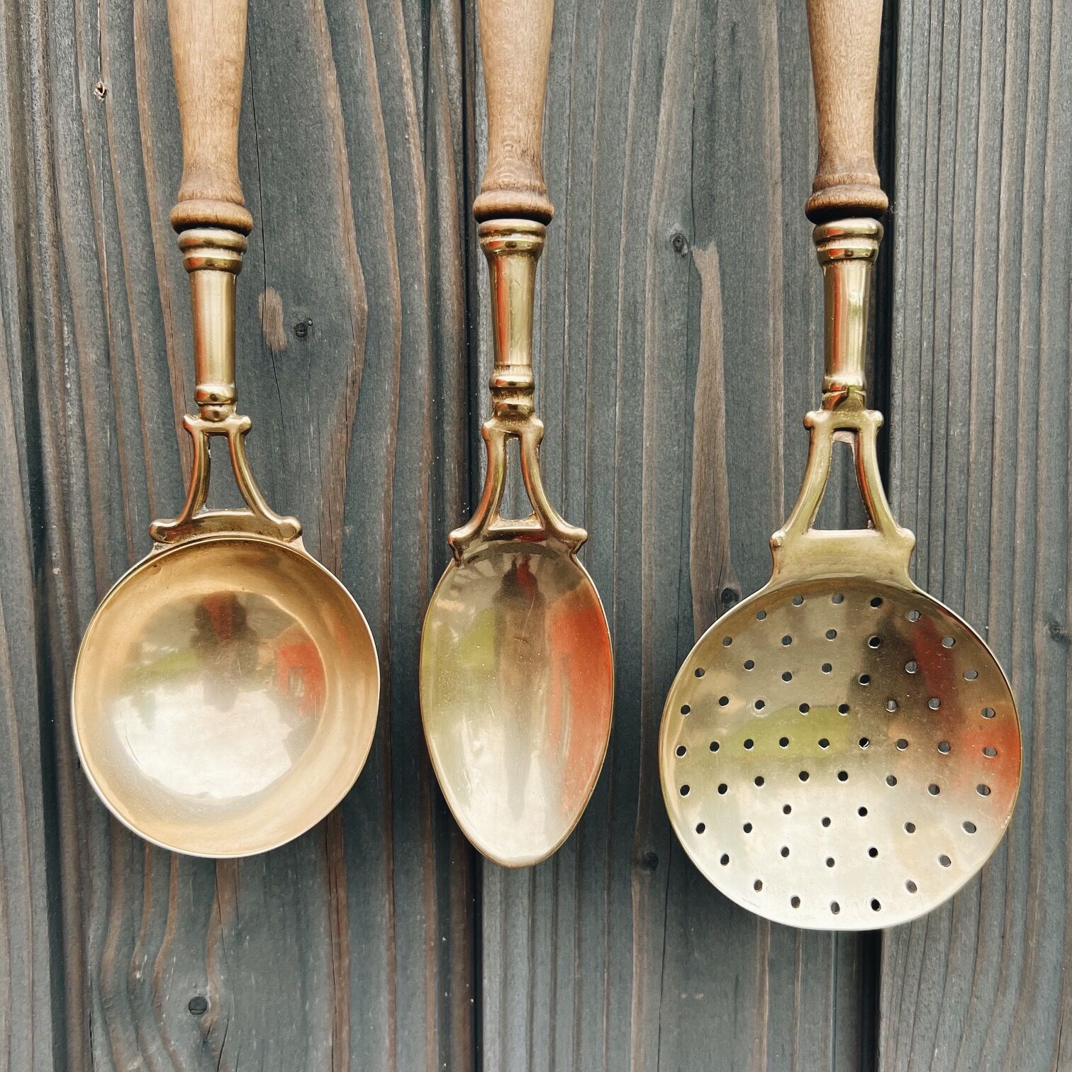 Brass holder with 3 brass & wood utensils