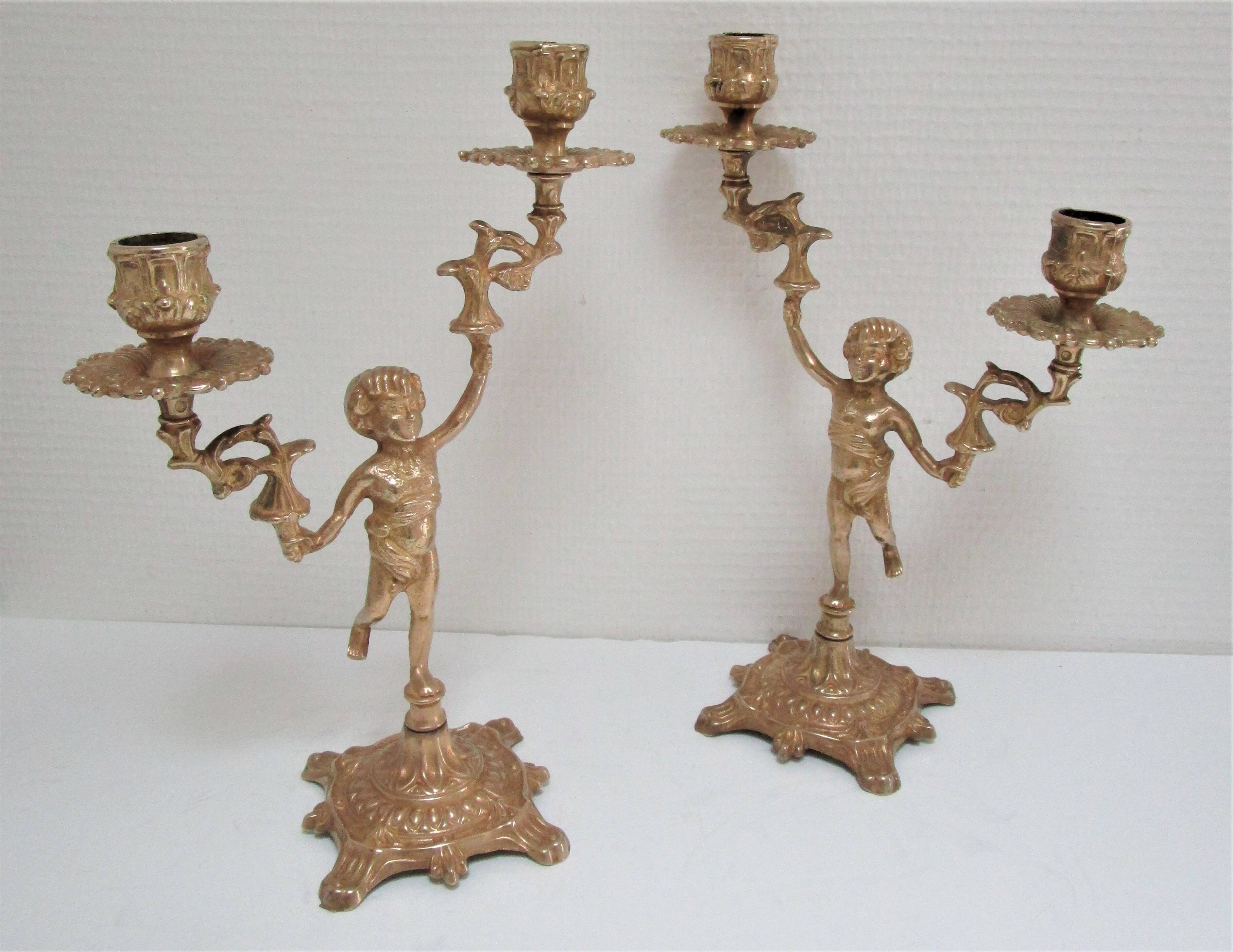 Pair of vintage golden brass cherub candlesticks