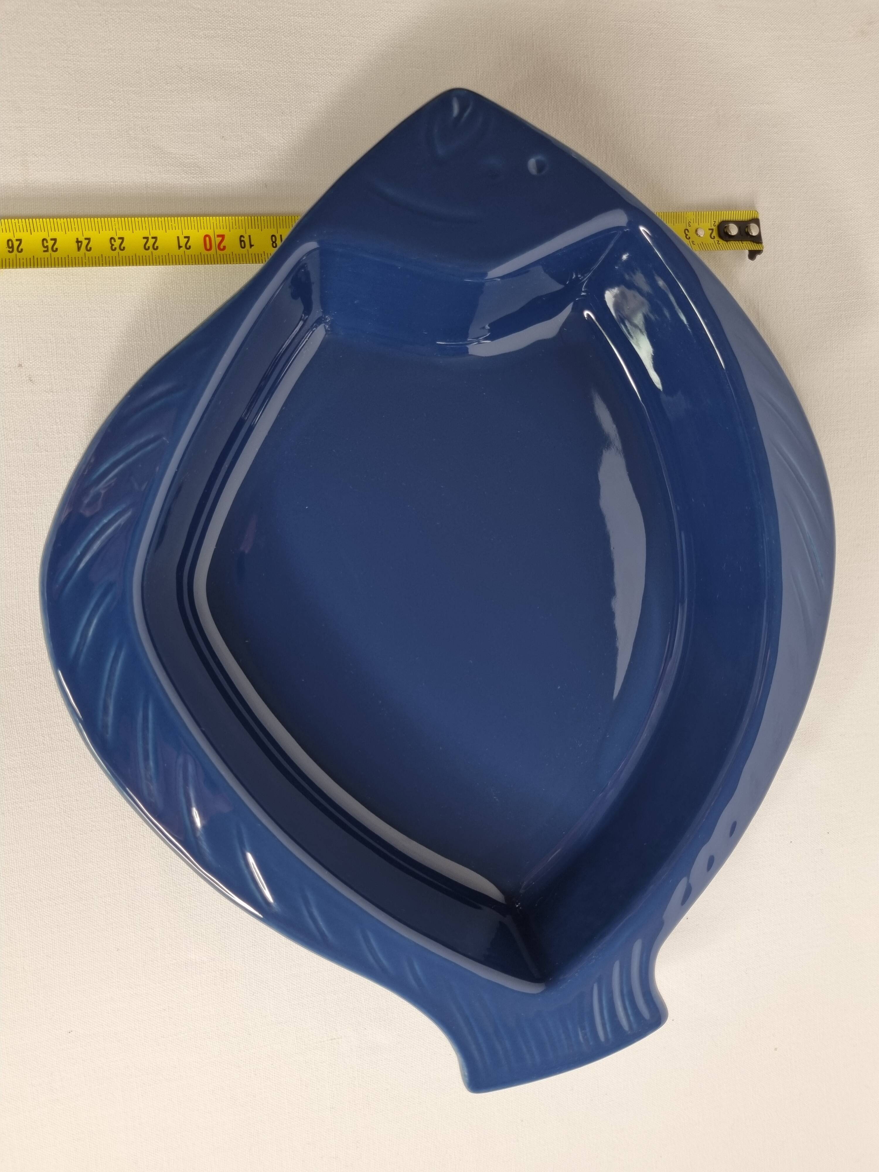 Blue ceramic serving dish in the shape of a fish signed Émile Henry