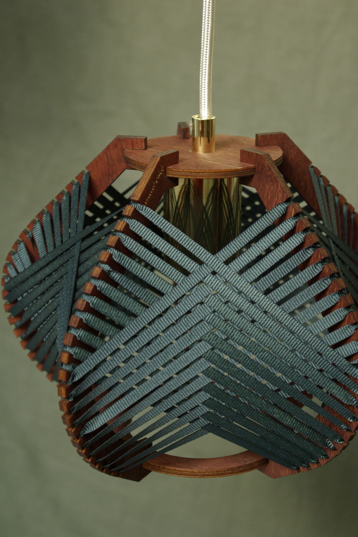 Dark green woven lamp to hang