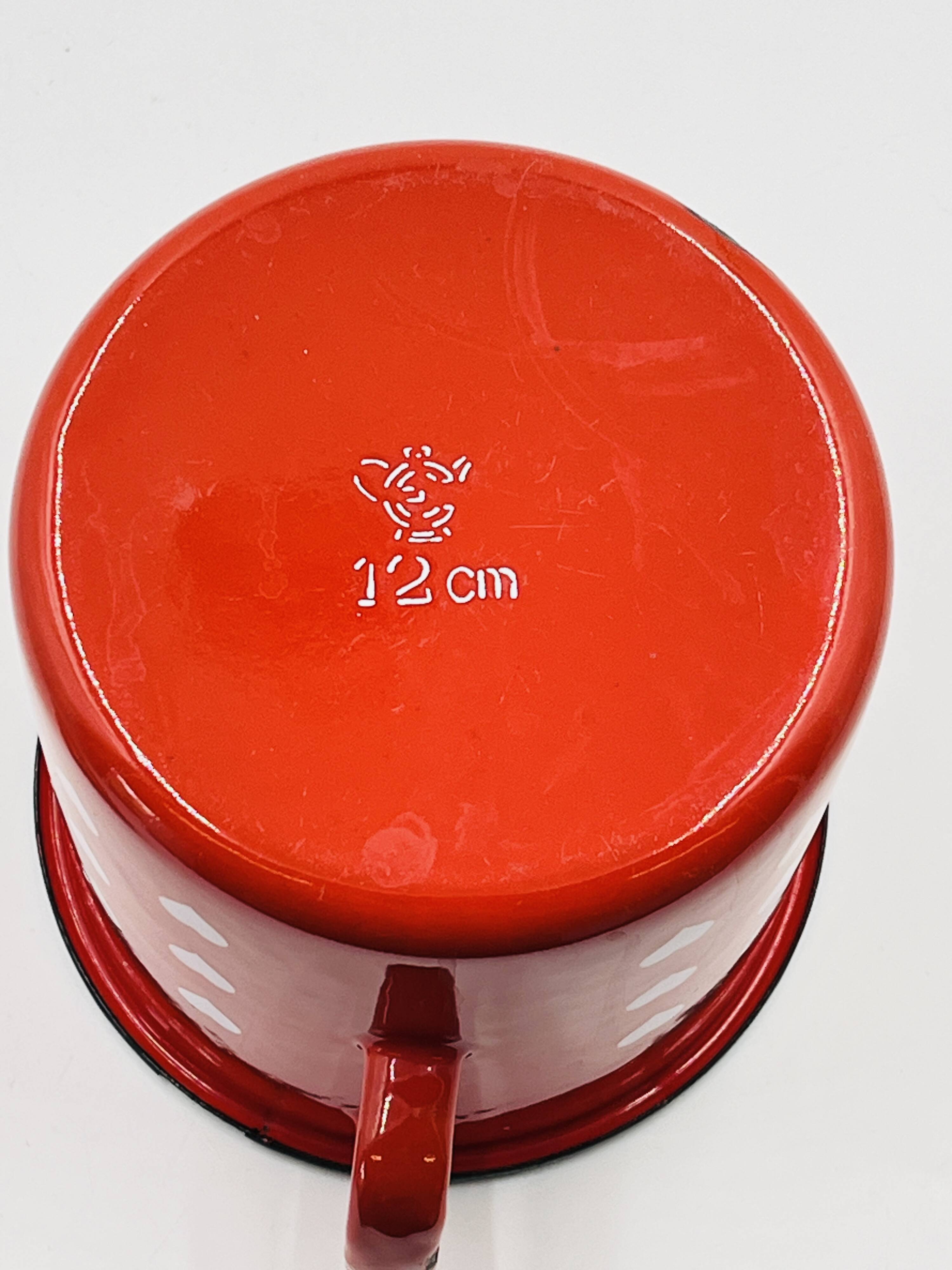 Vintage red enamelled measuring jug with hearts