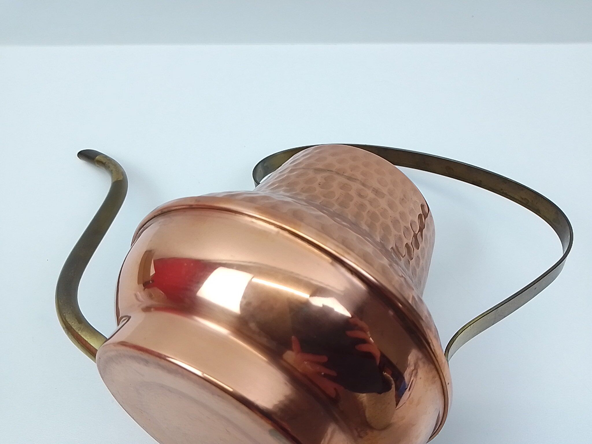 Copper and brass watering can