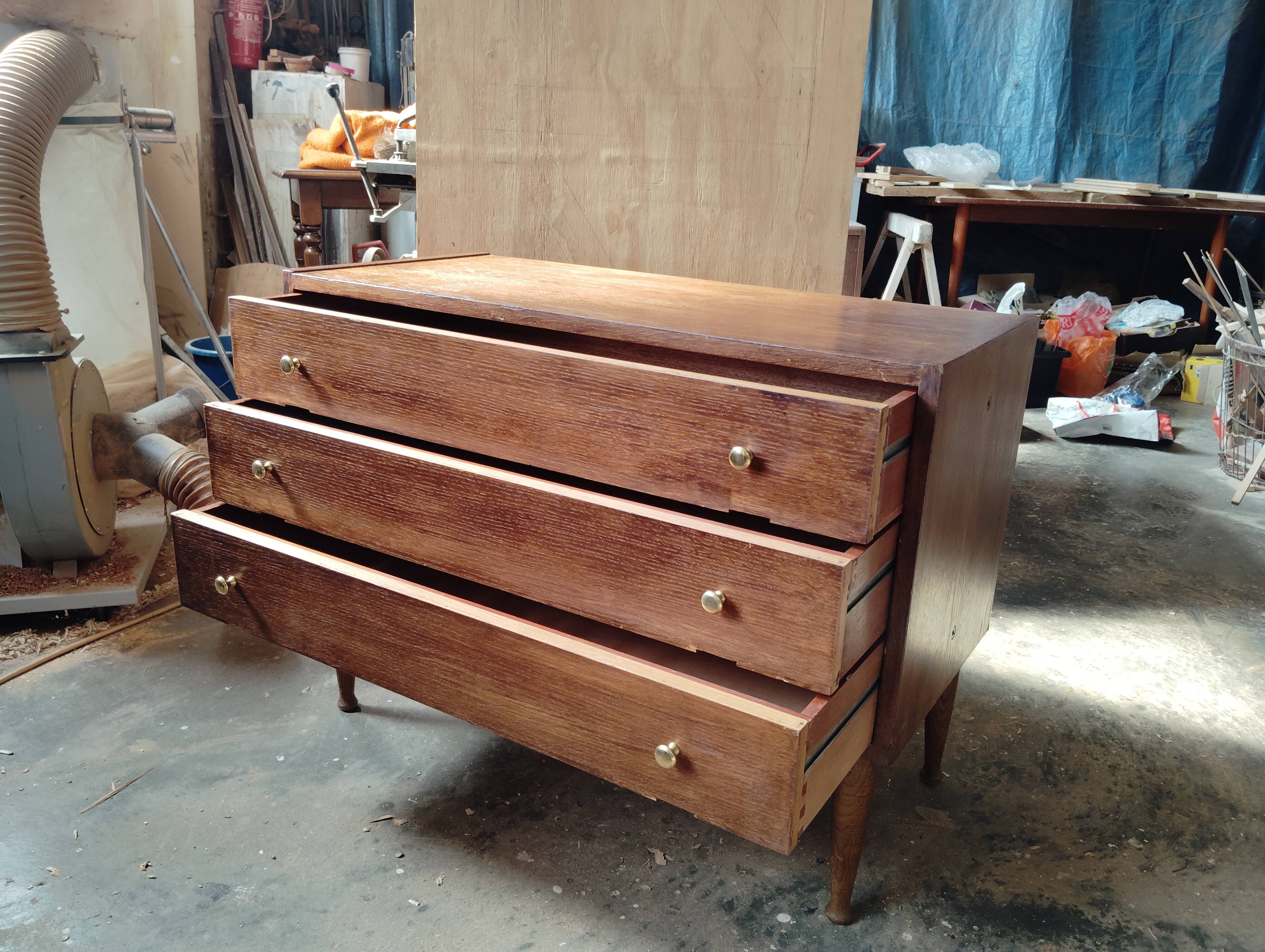 Vintage commode with tapered legs.