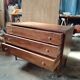 Vintage commode with tapered legs.