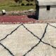 Very large vintage Beni Ouarain rug in cream wool with black diamonds, 426x344cm.