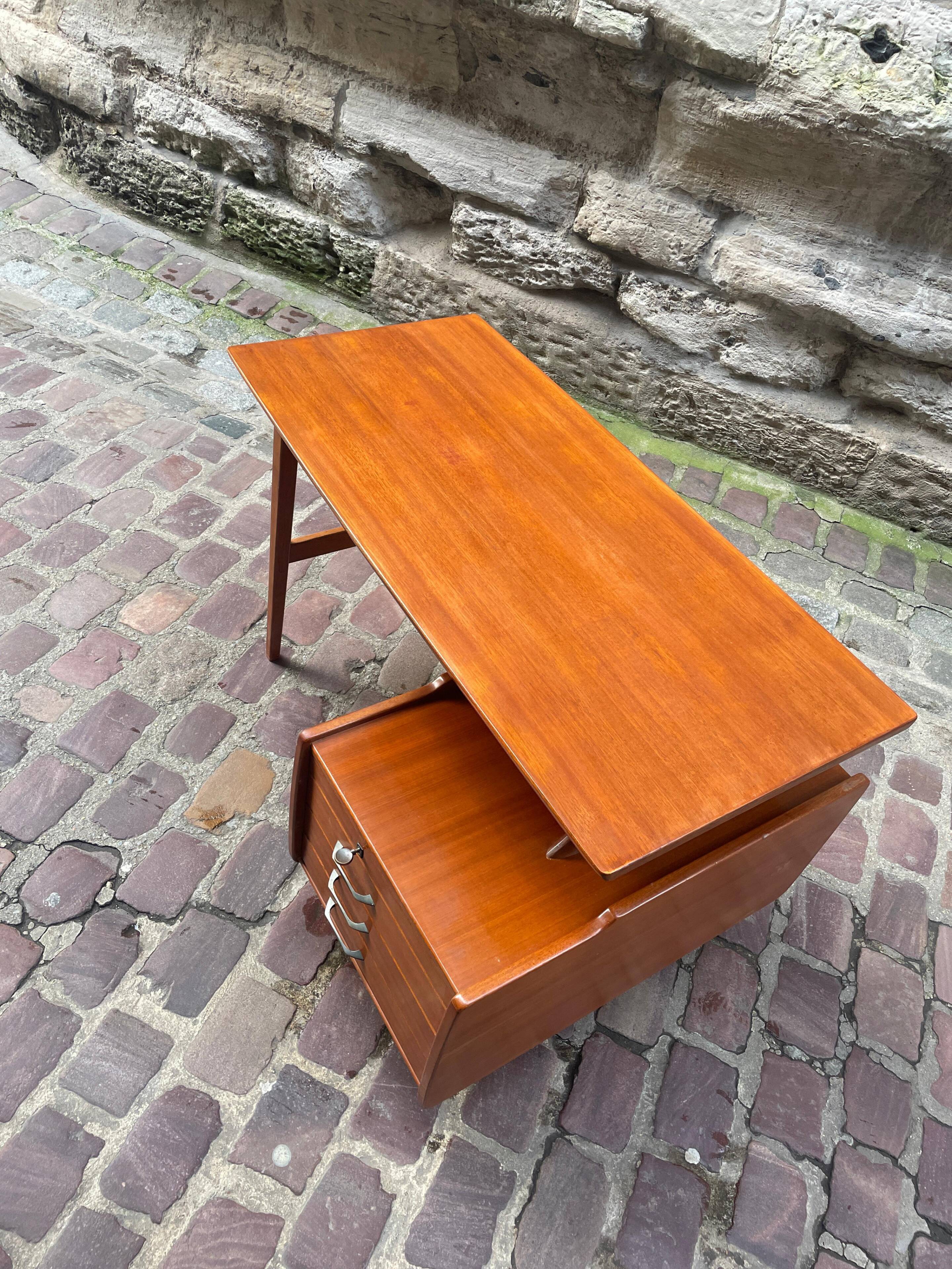 Mahogany desk with drawers by Jacques Hauville published by Bema.