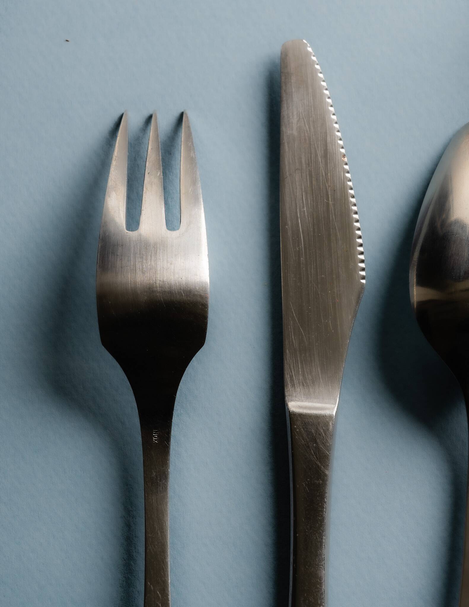 GUY DEGRENNE STAINLESS STEEL CUTLERY SET, 1970s
