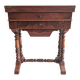 Antique wooden sewing cabinet with mirror and storage.