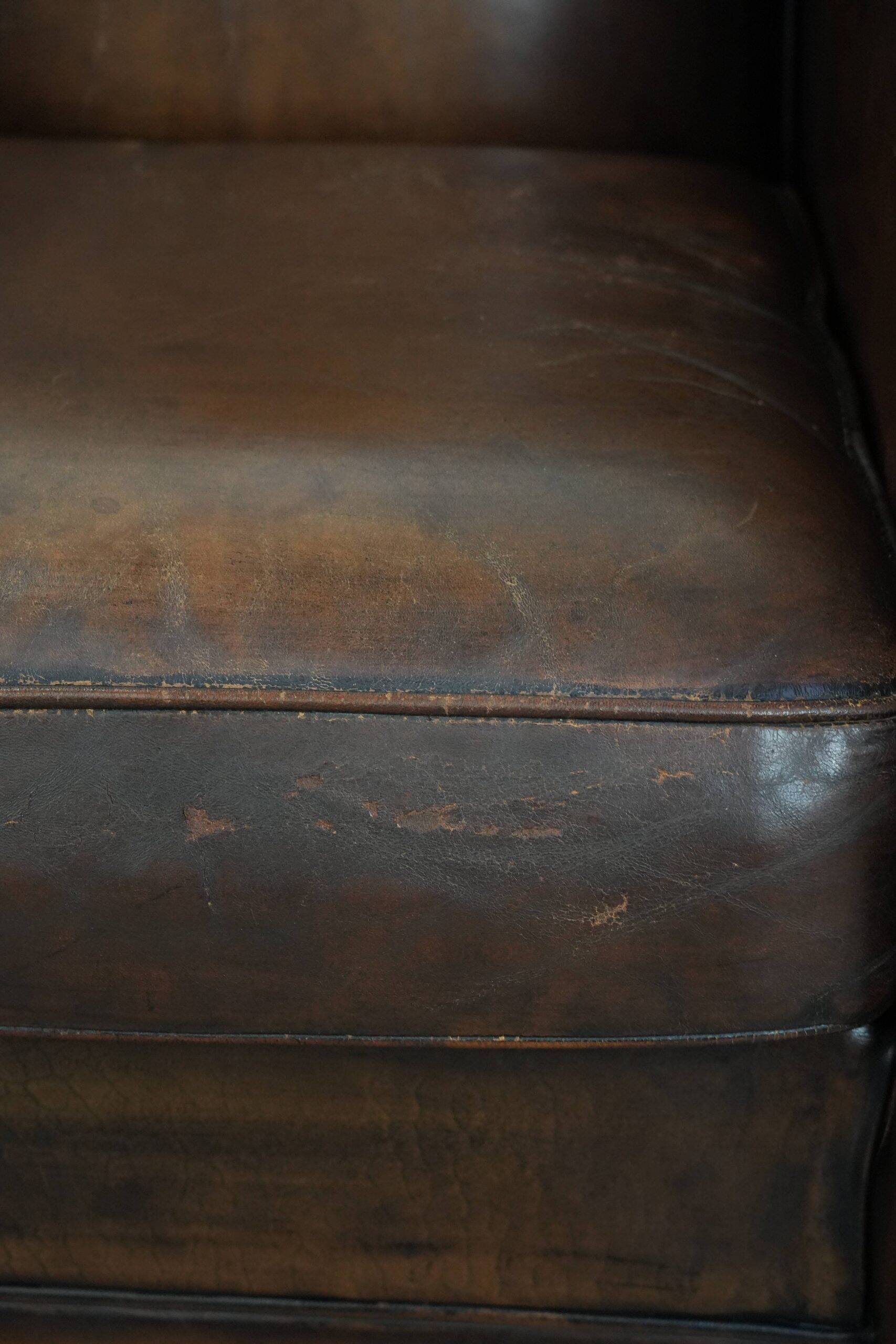 Characterful vintage sheepskin leather armchair with beautiful colours