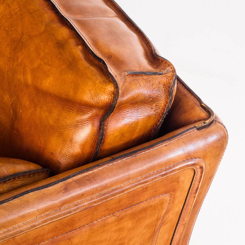 Vintage club armchair by Roche Bobois. Camel buffalo leather. France, 1980s.