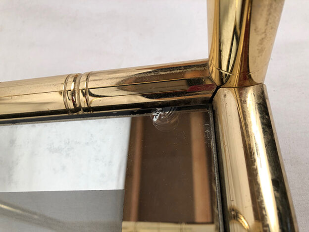 Lancel House gilded metal coffee table, two glazed tops