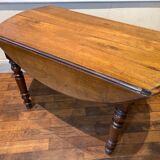 Table with oval shutter in walnut foot turned