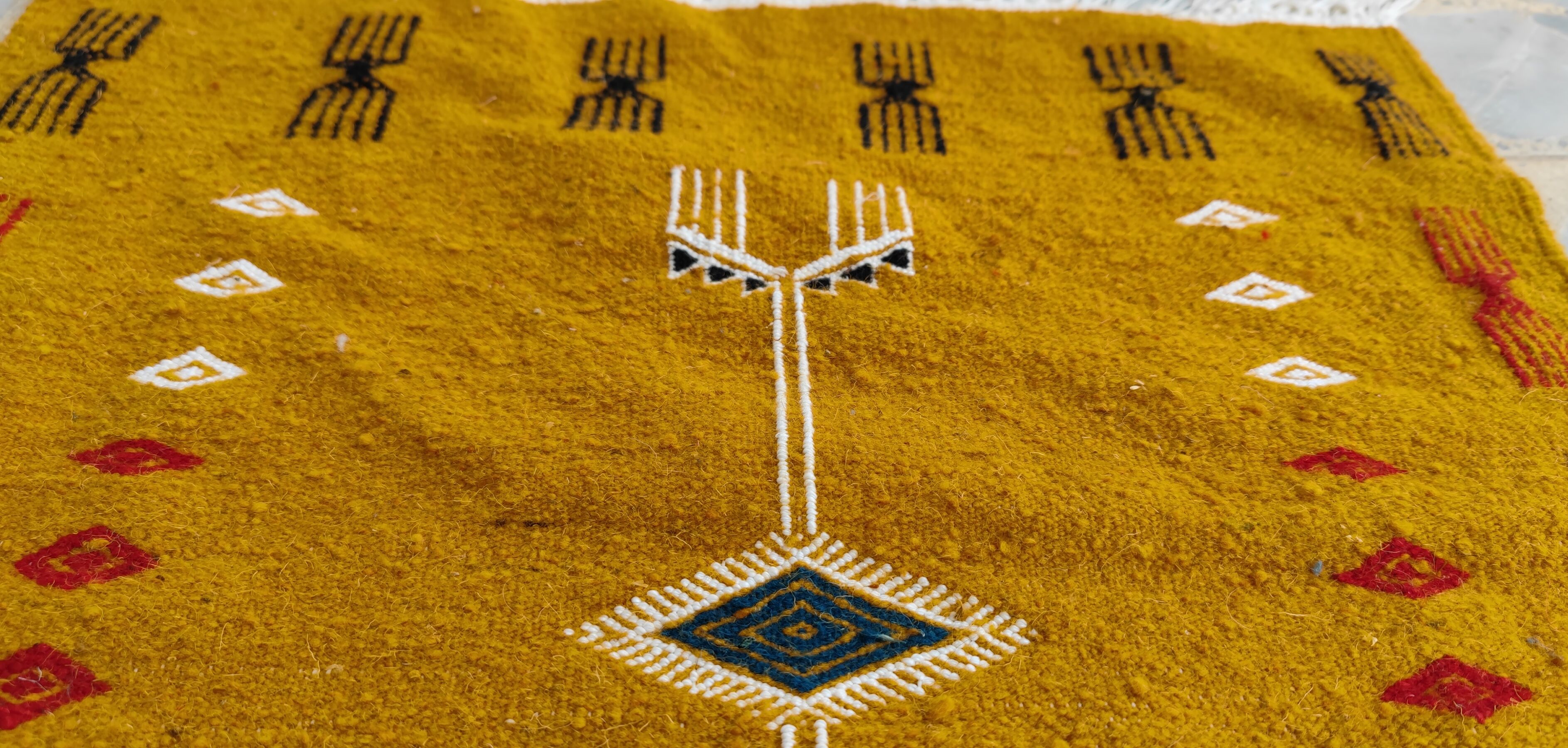 Mustard yellow kilim carpet with multicolored berber patterns