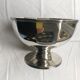 Silver metal cut with panels cut on pedestal, Christian Dior