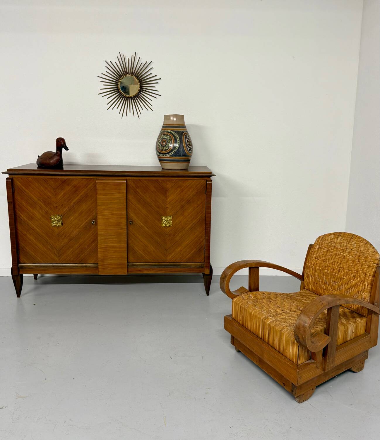 Antique art deco sideboard from the 1930s with veneered wood and bronze insert