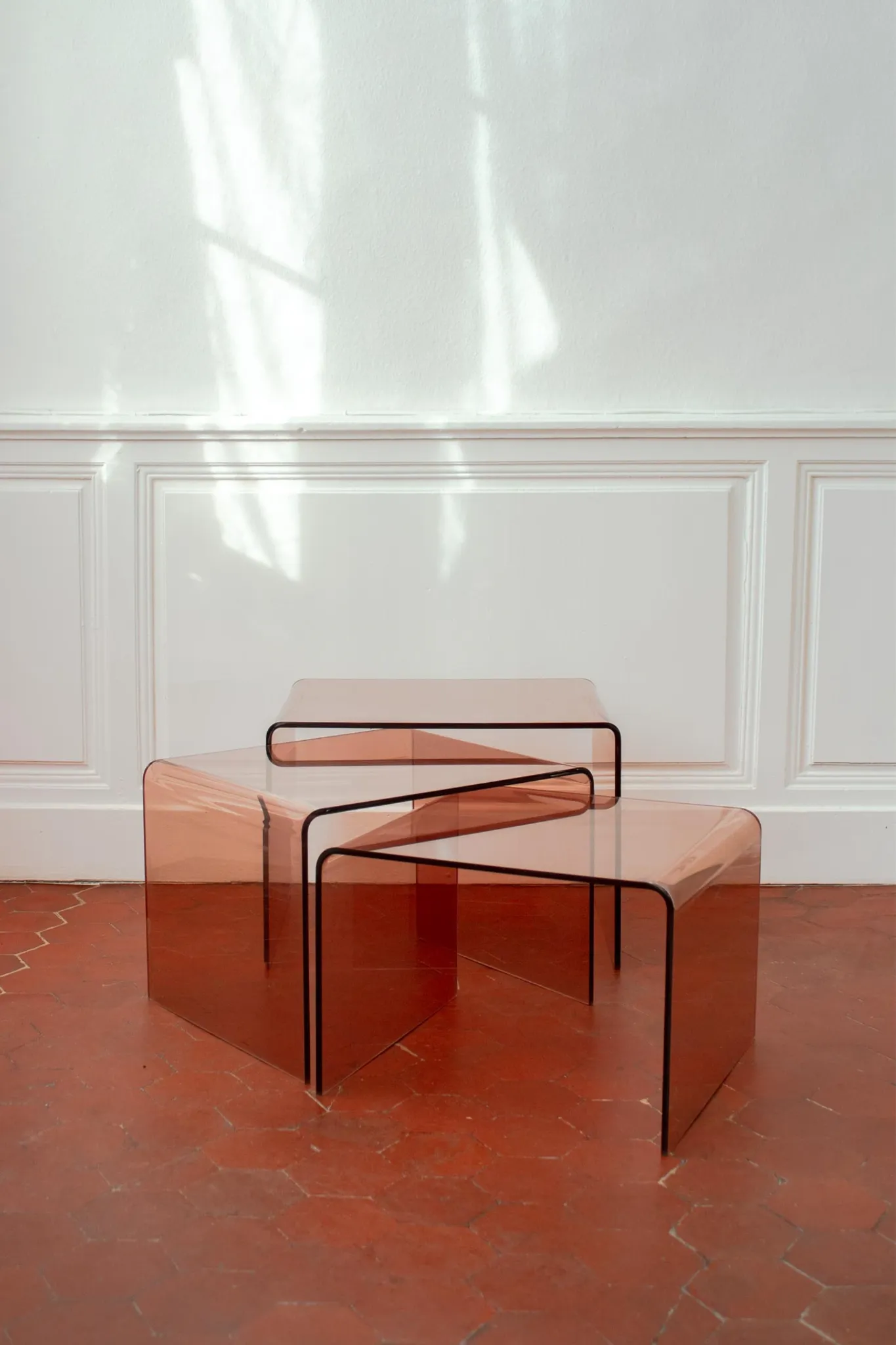 Vintage trio of nesting tables in smoked plexiglass by Michel Dumas, year