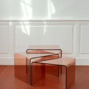 Vintage trio of nesting tables in smoked plexiglass by Michel Dumas, year