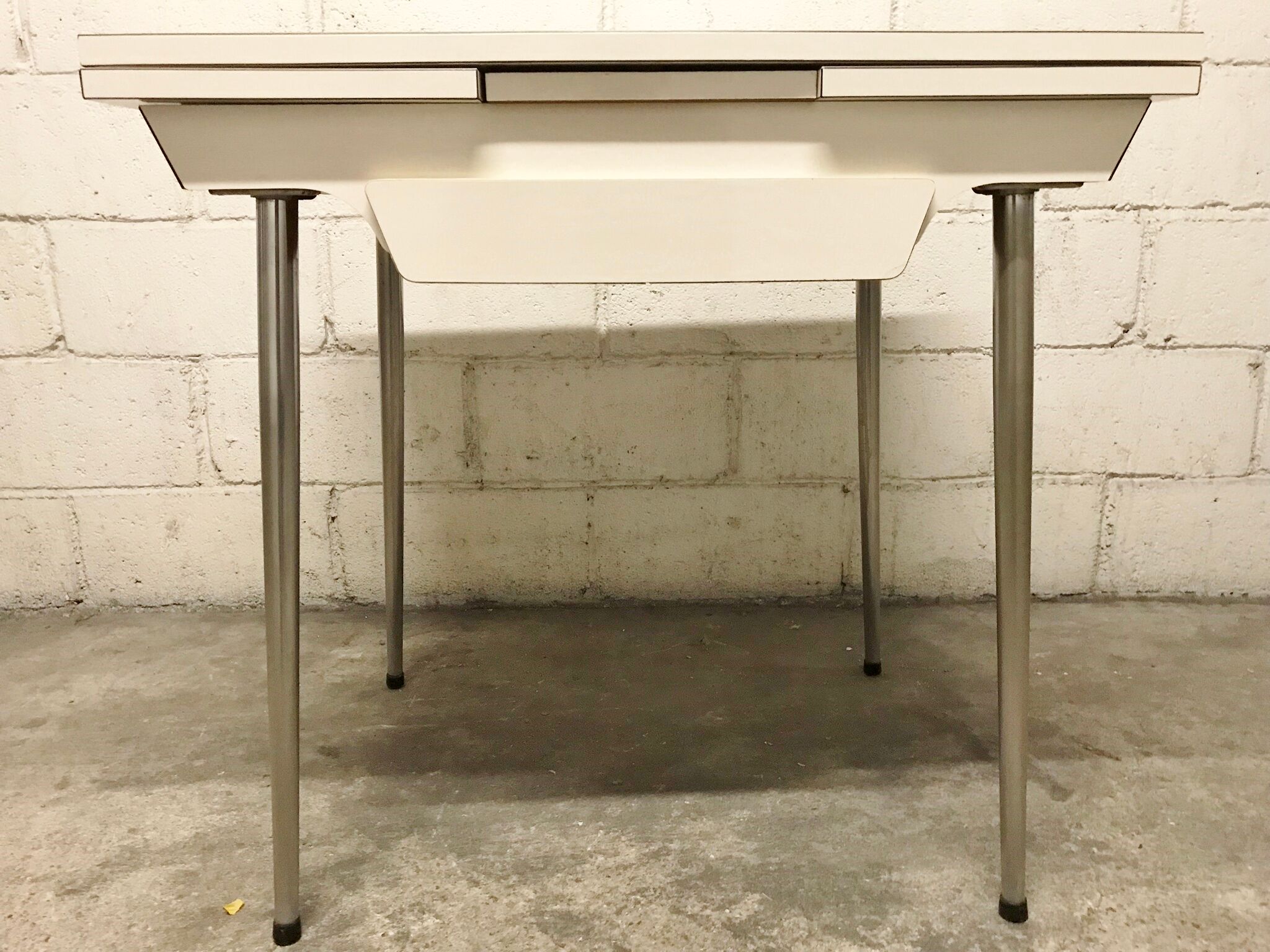 Off-white formica table / 70s cream with a tapered foot drawer