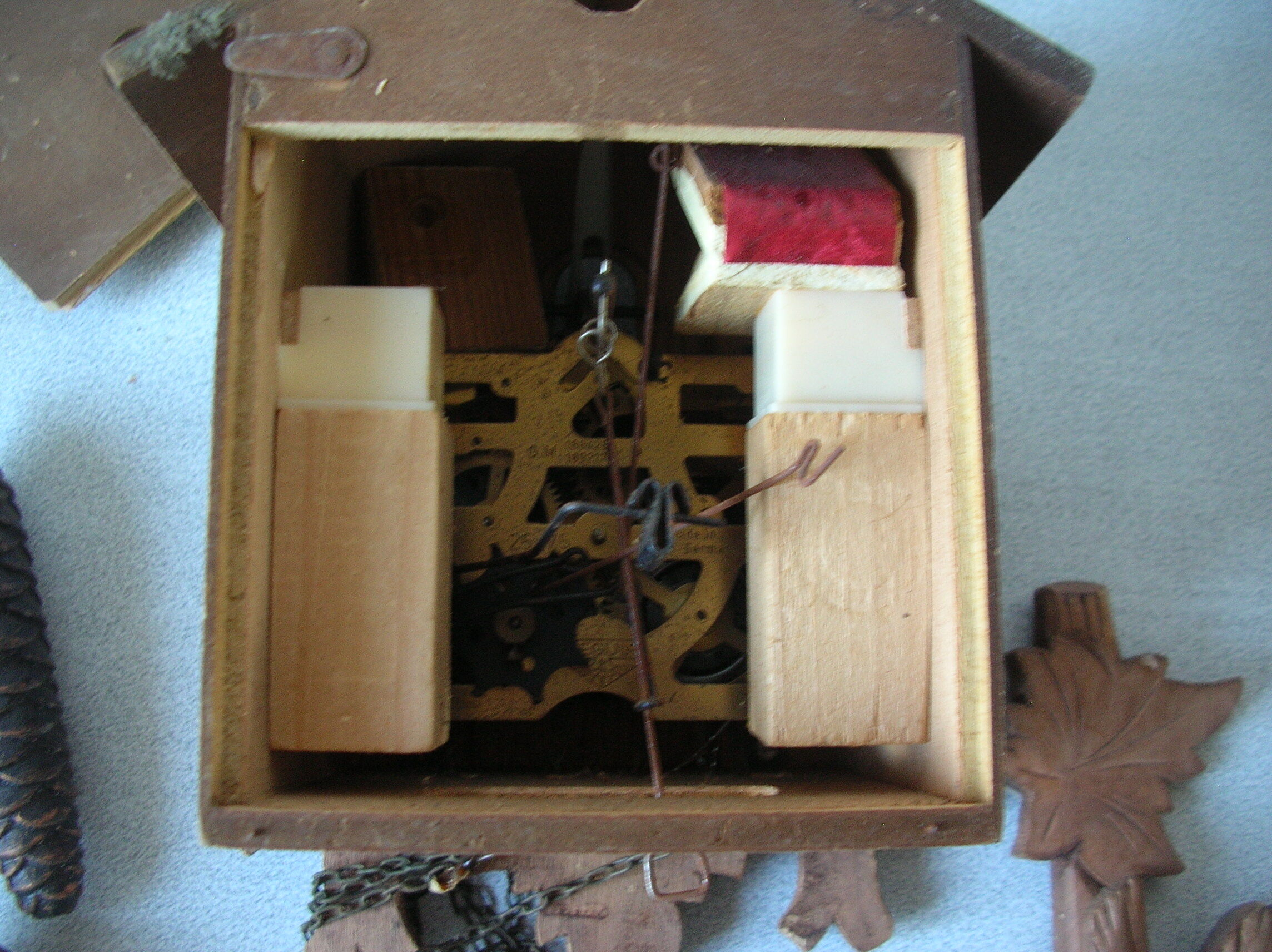 Old mechanical cuckoo regula wooden weight pine cone clock pendulum