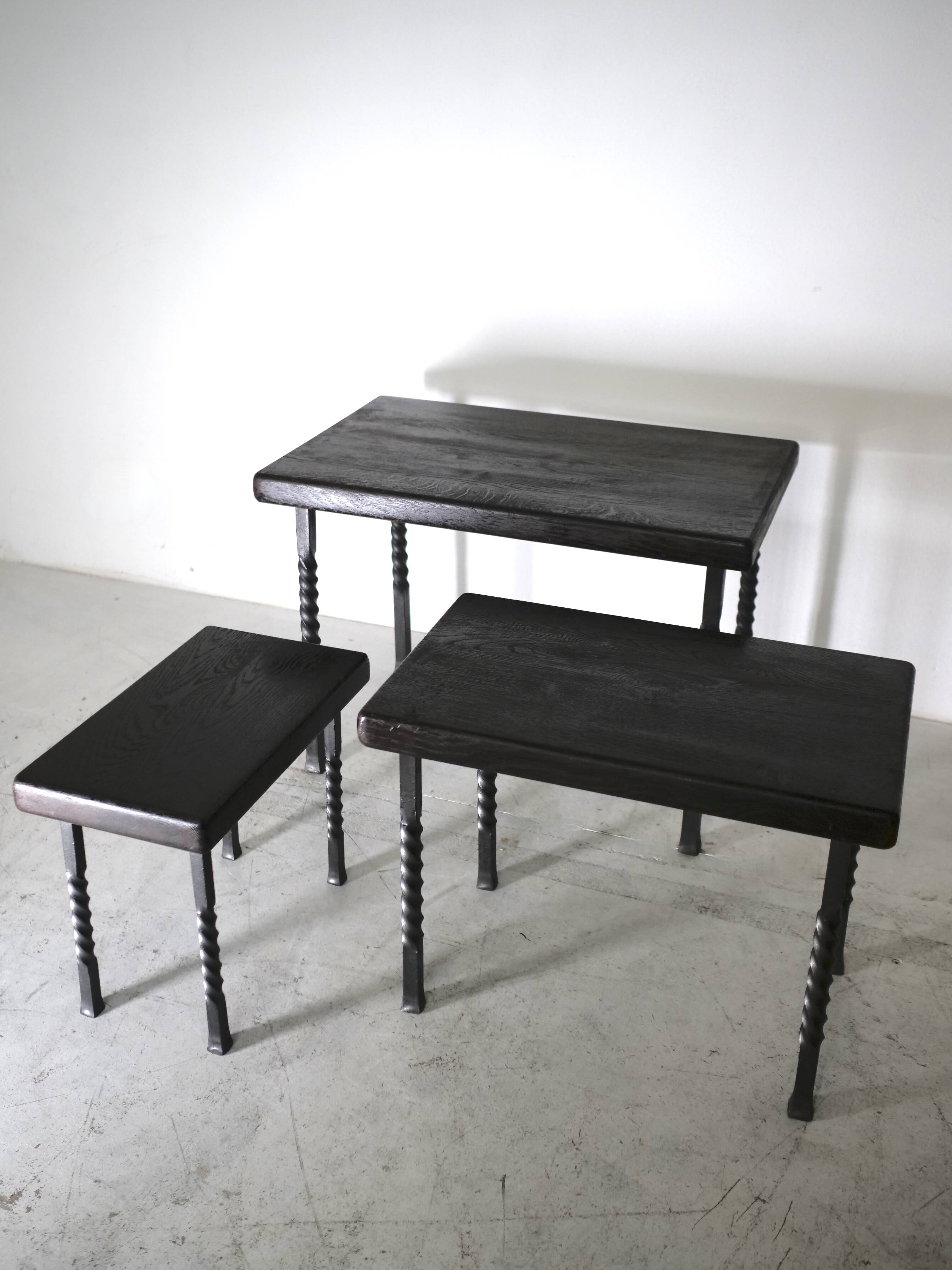 Brutalist nesting table in ebonized oak and wrought iron