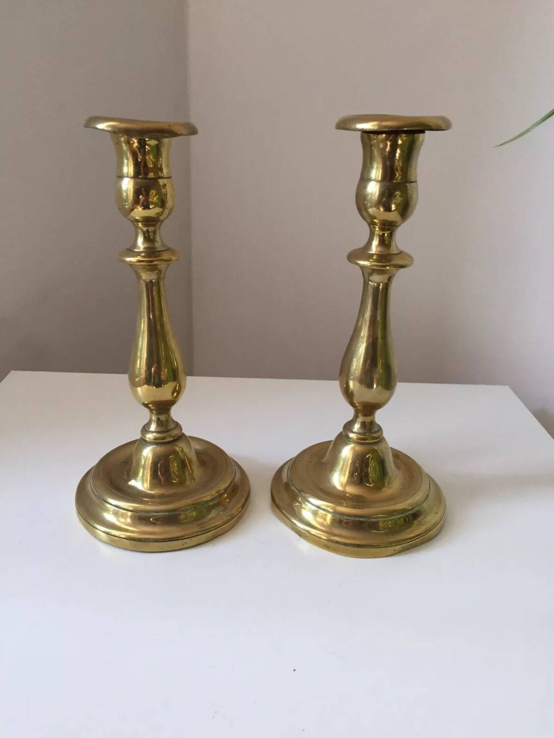 Pair of antique gilt brass candlesticks