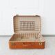 Valise de couleur cognac, valise dure