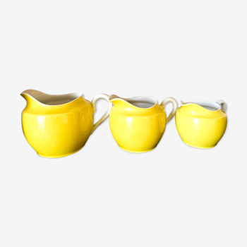 3 yellow milk jugs