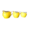 3 yellow milk jugs