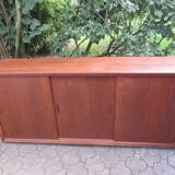 Low sideboard with 3 sliding doors in teak. Denmark 1960