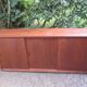 Low sideboard with 3 sliding doors in teak. Denmark 1960