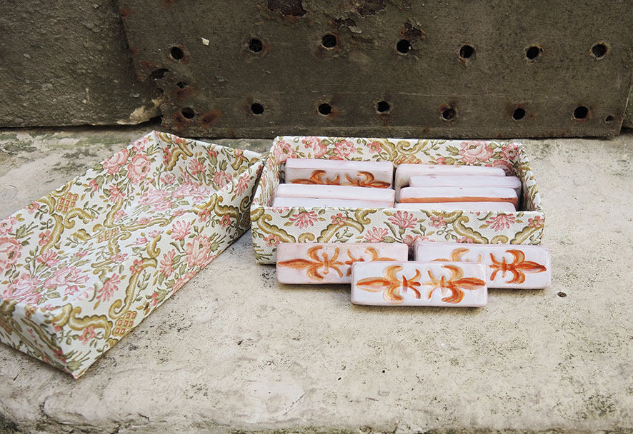 12 ancient fleur de lys knife holders in terracotta
